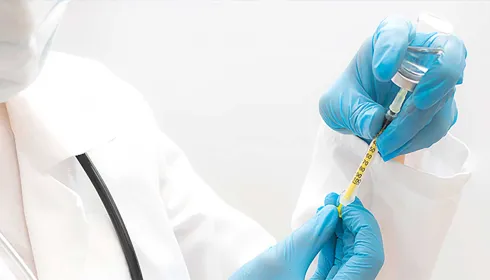 hands holding needle